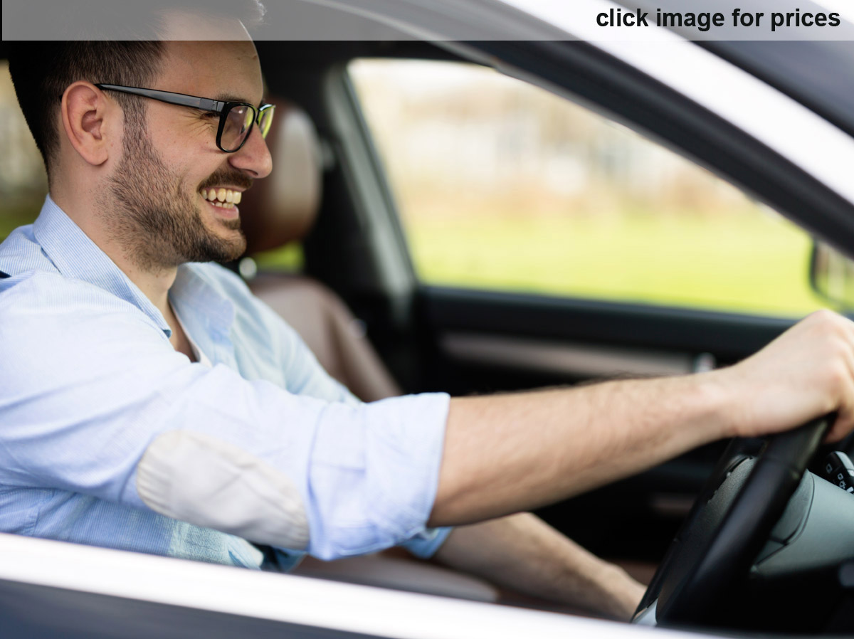 confident male driving car