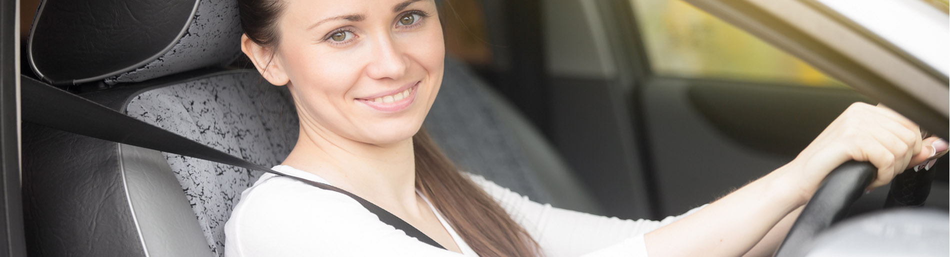 young woman driving car